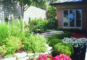 Shady side garden opens to a sunny view of Ohio River.