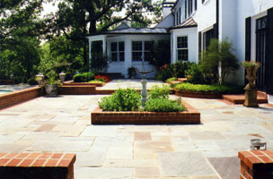 Formal two level terrace built in kitchen garden, & armillary sphere.